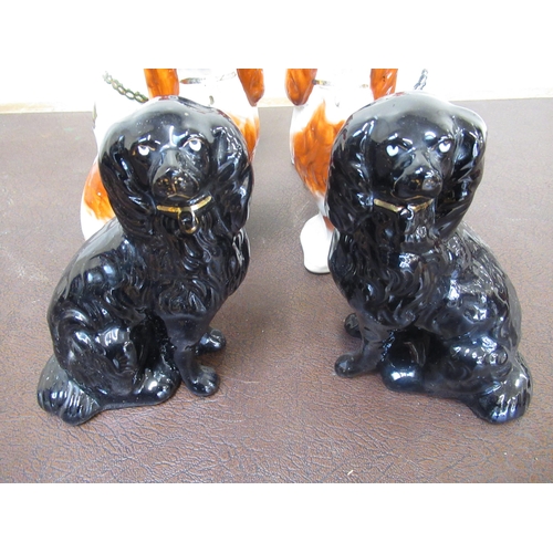 180 - Three pairs of Staffordshire type spaniels, lustre, brown and black decorated, H24cm max (6)