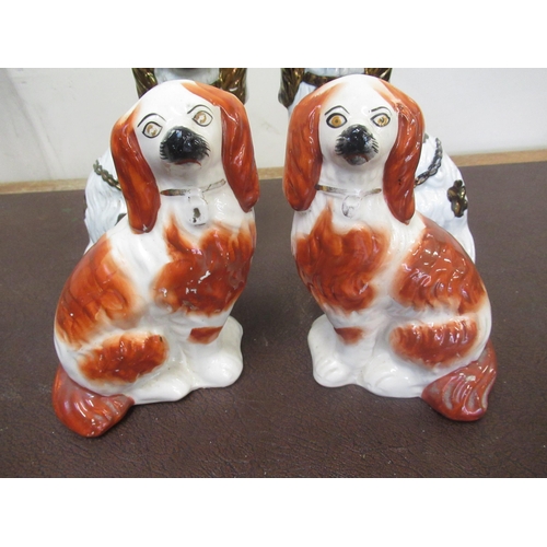 180 - Three pairs of Staffordshire type spaniels, lustre, brown and black decorated, H24cm max (6)