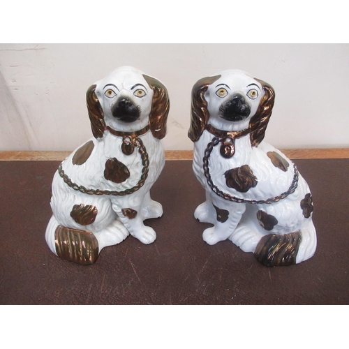 180 - Three pairs of Staffordshire type spaniels, lustre, brown and black decorated, H24cm max (6)