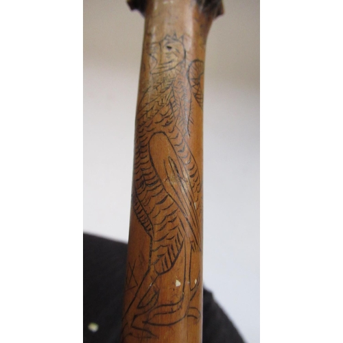 144 - Victorian naïve walking stick, handle carved as a male face with glass eyes, all over penwork decora... 