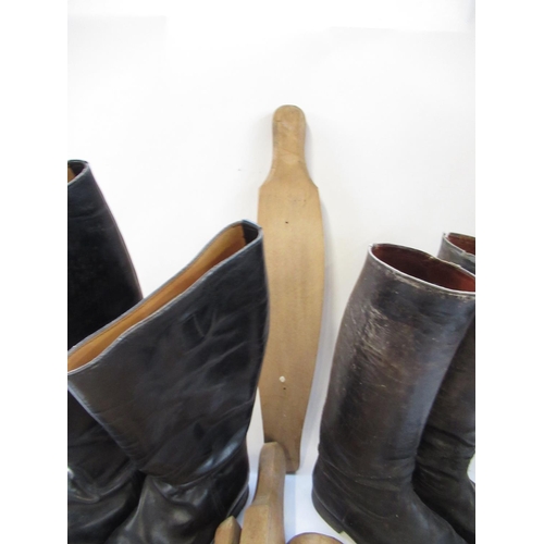 146 - Pair of black leather riding boots, size 12, a similar smaller pair and two pairs of wooden boot tre... 