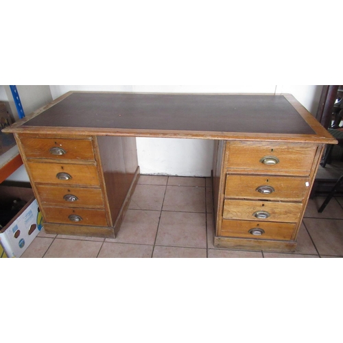 215 - C20th oak twin pedestal desk with inset top and eight drawers, W170cm D80cm H77cm