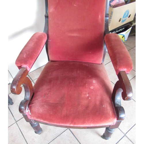 218 - Victorian mahogany framed upholstered open arm chair, turned supports with brass castors, H105cm