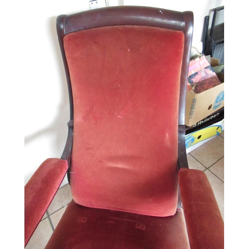 218 - Victorian mahogany framed upholstered open arm chair, turned supports with brass castors, H105cm