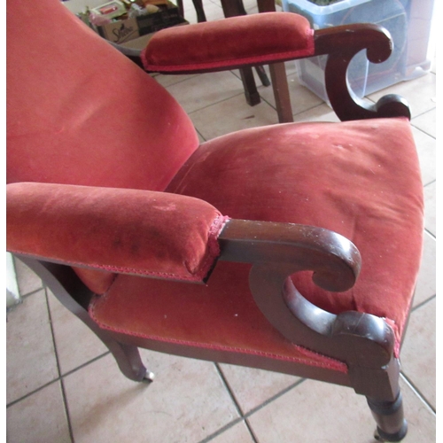 218 - Victorian mahogany framed upholstered open arm chair, turned supports with brass castors, H105cm