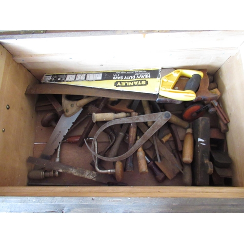 222 - C20th pitch pine joiners tool box containing chisels, saws, brace, scribes etc, W80cm W50cm H36cm