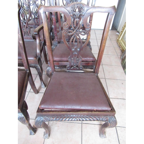 225 - Set of eight Chippendale style mahogany dining chairs, with drop-in seats on cariole legs with claw ... 