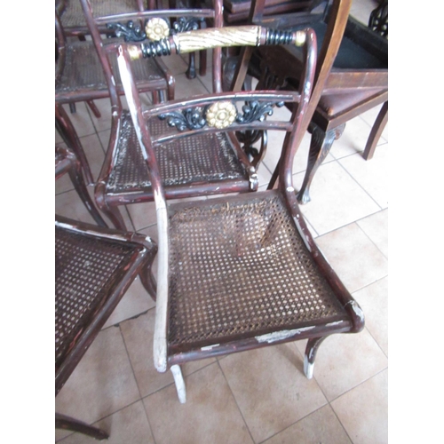 226 - Set of eight Regency style dining chairs, later painted as parcel gilt rosewood, with canework seats... 