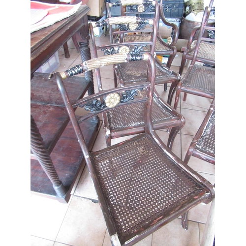 226 - Set of eight Regency style dining chairs, later painted as parcel gilt rosewood, with canework seats... 