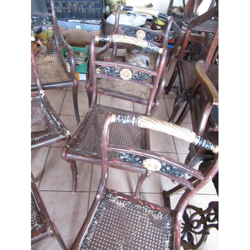 226 - Set of eight Regency style dining chairs, later painted as parcel gilt rosewood, with canework seats... 