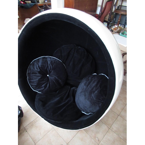 227 - Vintage white finished egg chair, black interior with four cushions on swivel base, H134cm W107cm