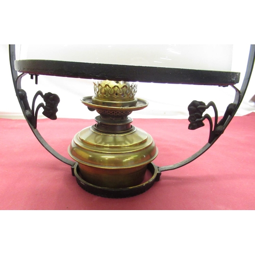 307 - C20th hanging oil lamp with steel strapwork frame with Art Nouveau motifs, brass reservoir with opaq... 