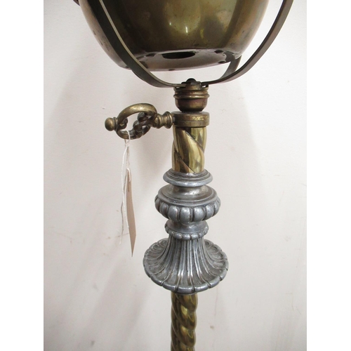 309 - C20th wrought iron and brass floor standing rise and fall oil lamp with barley twist column, over ca... 