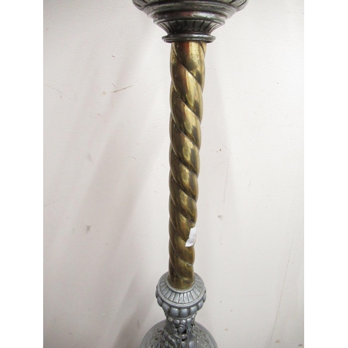 309 - C20th wrought iron and brass floor standing rise and fall oil lamp with barley twist column, over ca... 