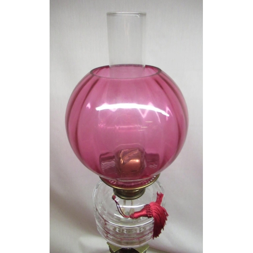 315 - Late C19th oil lamp, cranberry coloured shade, faceted clear glass reservoir on sienna marble corint... 