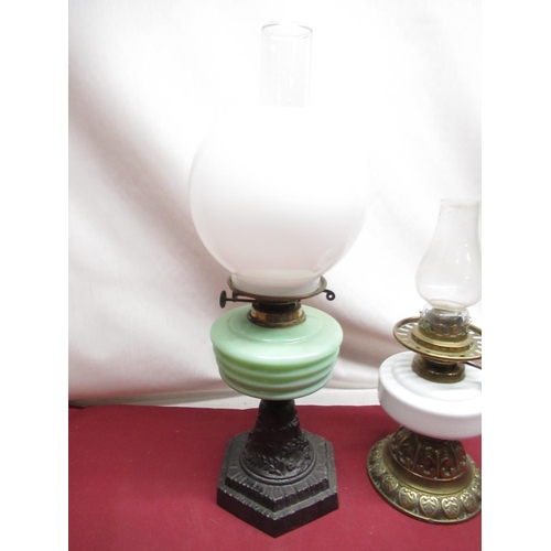 318 - Early C20th oil lamp with opaque glass shade, opaline green tinted reservoir on cast metal base, H55... 