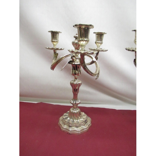 131 - Pair of C20th EPNS rococo design three branch candelabra with scrolled rustic arms, converted to ele... 