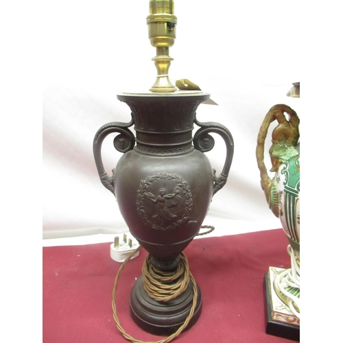 133 - Late Victorian Wedgwood basalt ware vase, with baluster design body, scroll handles on circular wood... 