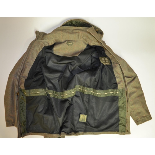 29 - New Musto polyester tweed shooting jacket, with detachable hood, size medium.