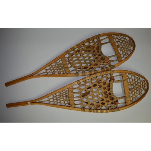 51 - Pair of wooden snow shoes with leather boot strapping. Made by Faber, Loretteville, Quebec, Canada. ... 