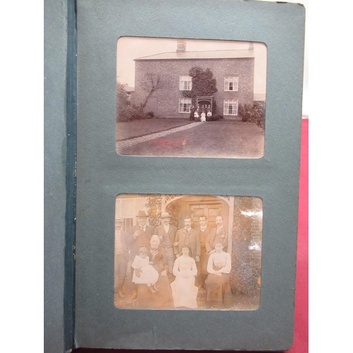 366 - Two early C20th family photograph albums containing social history photographs, topographical photog... 