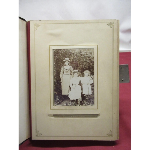 372 - Late Victorian monogrammed photograph album containing carte de visite and cabinet cards, three quar... 