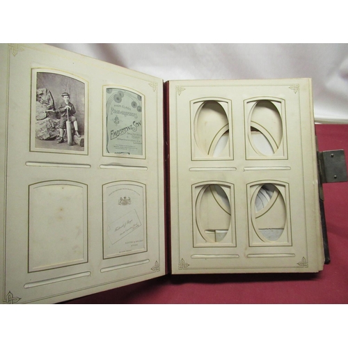 372 - Late Victorian monogrammed photograph album containing carte de visite and cabinet cards, three quar... 