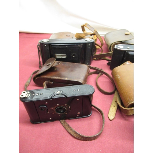 379 - Coronet folding camera with F7.7 lens and case, Kodak Brownie folding camera patented March 4th 1902... 