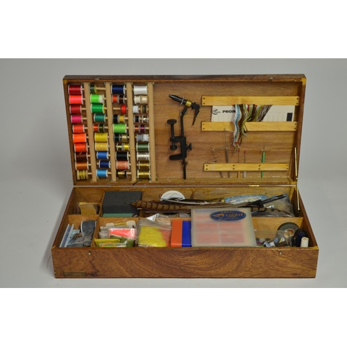 55 - An extremely comprehensive fly tying set including 2 table top fly vices, feathers, coloured thread,... 