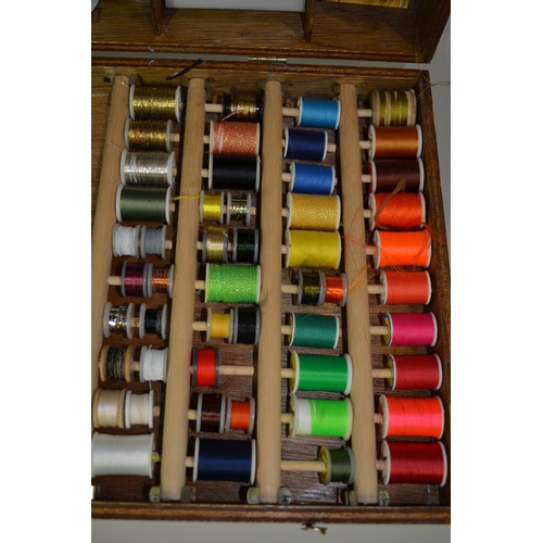 55 - An extremely comprehensive fly tying set including 2 table top fly vices, feathers, coloured thread,... 