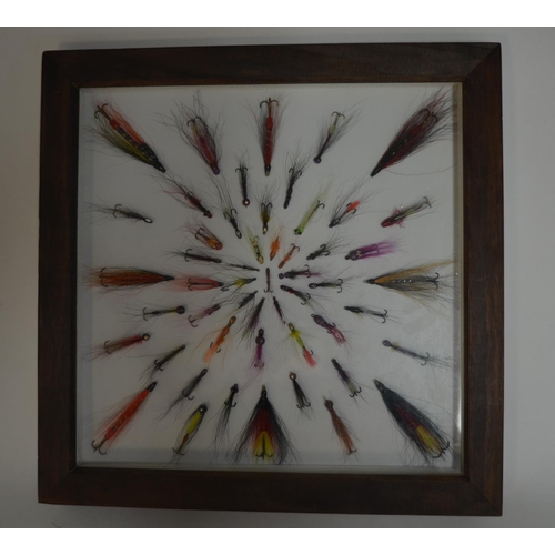 57 - Framed Salmon and Trout lures in a symmetrical pattern. Frame glass and wood. W35.5cm D3.4cm H35.5cm