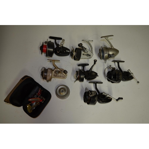 Collection of seven vintage spinning reels including J.W. Young