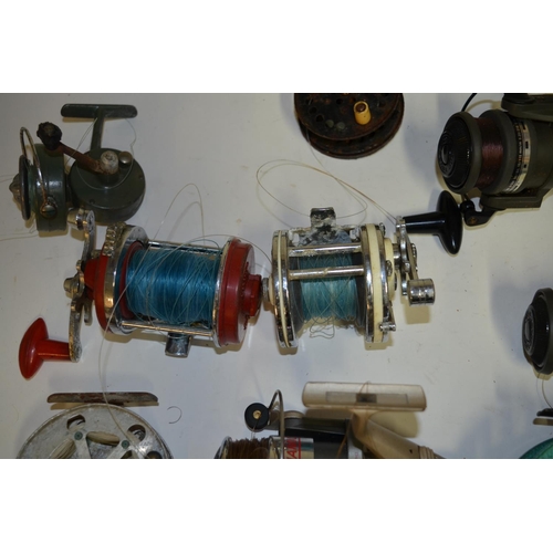 65 - A collection of fishing equpiment including side arm reels, multipliers, centrepin reels, fishing li... 