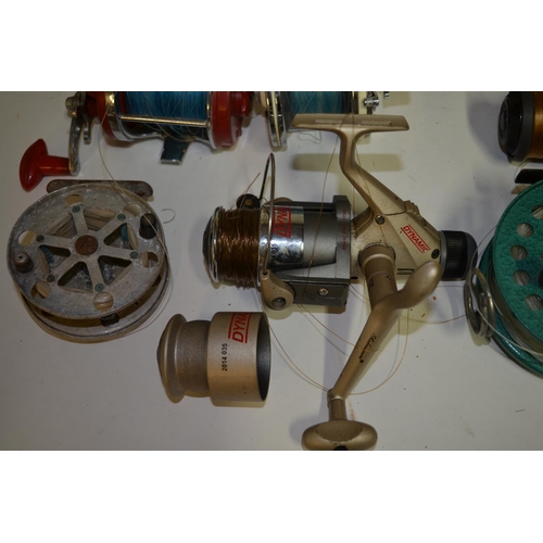 65 - A collection of fishing equpiment including side arm reels, multipliers, centrepin reels, fishing li... 