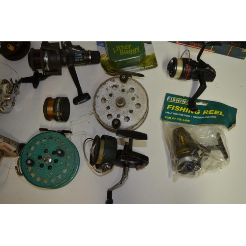 65 - A collection of fishing equpiment including side arm reels, multipliers, centrepin reels, fishing li... 