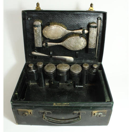 521 - Edw.VII Mappin and Webb fitted leather travelling vanity case with hallmarked silver and glass jars,... 