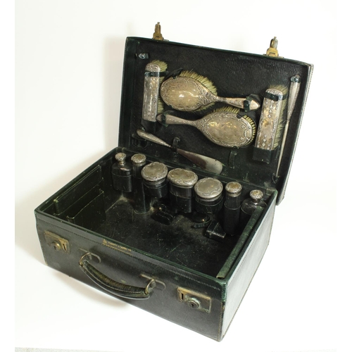 521 - Edw.VII Mappin and Webb fitted leather travelling vanity case with hallmarked silver and glass jars,... 