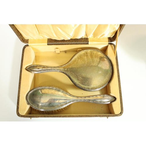 524 - Geo.V hallmarked silver dressing table hand mirror and brush set in original fitted case, David Moss... 