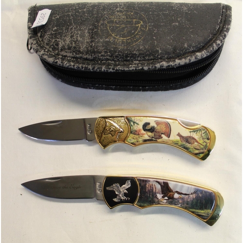 216 - Pair of Franklin Mint pocket knives with ornate engraving and pictures, one of wild turkeys, other b... 