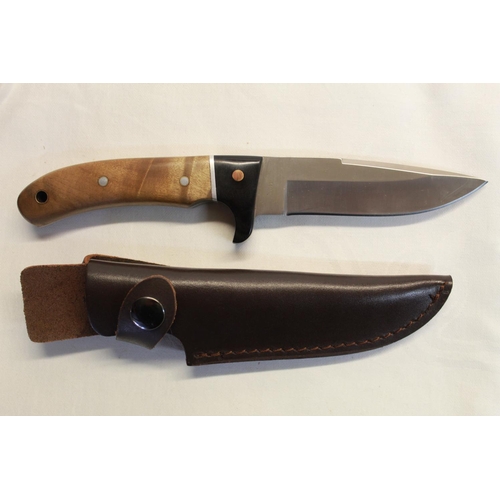 226 - Magnum sheath knife by Boker, full tanged clip blade and two piece wooden handle, steel spacer and e... 