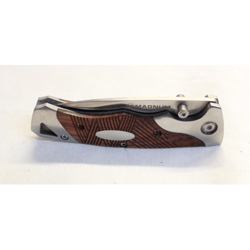 227 - As new Boker folding pocket knife with stainless steel blade and two piece resin handle including be... 