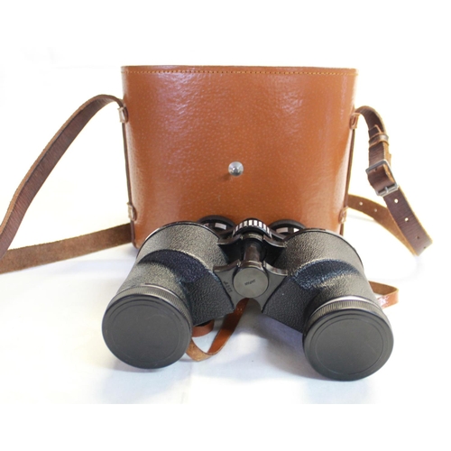 243 - A pair of Japanese Tohyoh action tested 7x-15x35 binoculars with leather case.