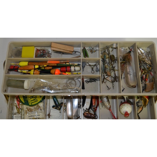 90 - A tackle box filled with lures, flies, Devon Minnows, line and accessories, a Daiwa 735 side-arm ree... 