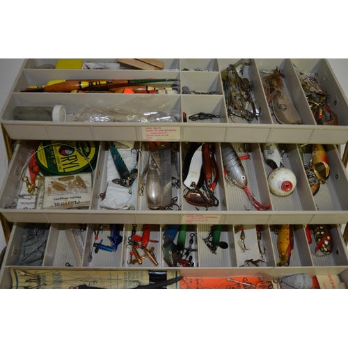 90 - A tackle box filled with lures, flies, Devon Minnows, line and accessories, a Daiwa 735 side-arm ree... 