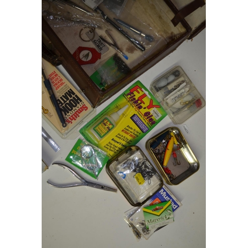 92 - A collection of mostly fishing related tools and accessories, includes forceps, an Orvis knot tyer, ... 