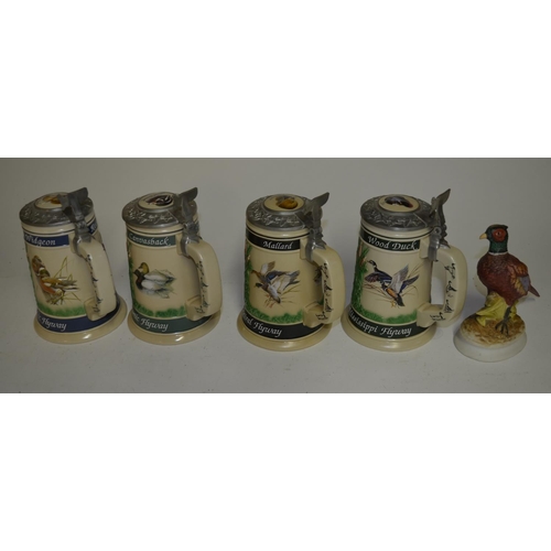 94 - A collection of shooting and fishing ephemera including 4 gamebird themed Steins, a wooden duck call... 