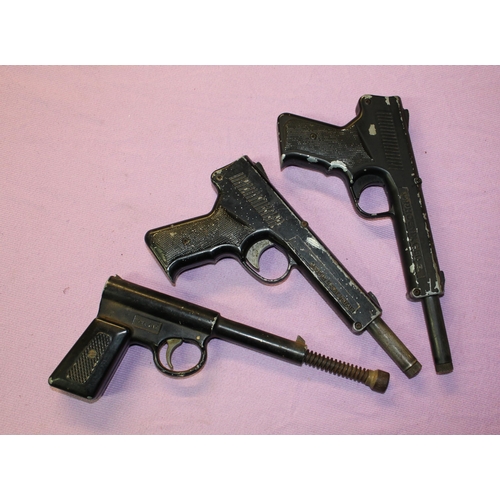 148 - 3 vintage pop out air pistols:
Phoenix G50 .177, working.
Diana SP50 .177, working.
Early T J Harrin... 