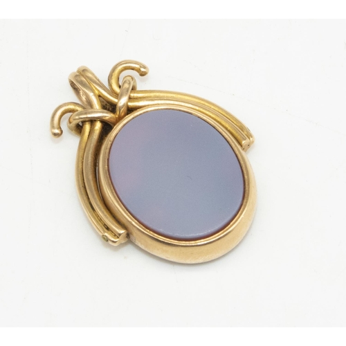 14 - 15ct yellow gold pendant with revolving face set with agate, stamped 625, H3.5cm, 11.0g