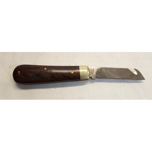 170 - Pocket knife with brown wooden handle, in leather pouch