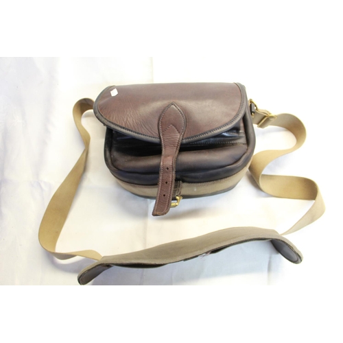 263 - Brown leather cartridge bag, black canvas interior with shoulder strap and 15 loop cartridge compart... 